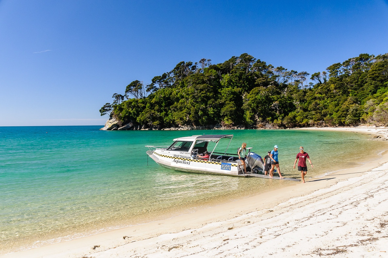 Abel Tasman Group Hopping Off Abel Tasman AquaTaxi Pic Courtesy Abel Tasman Aqua Taxi
