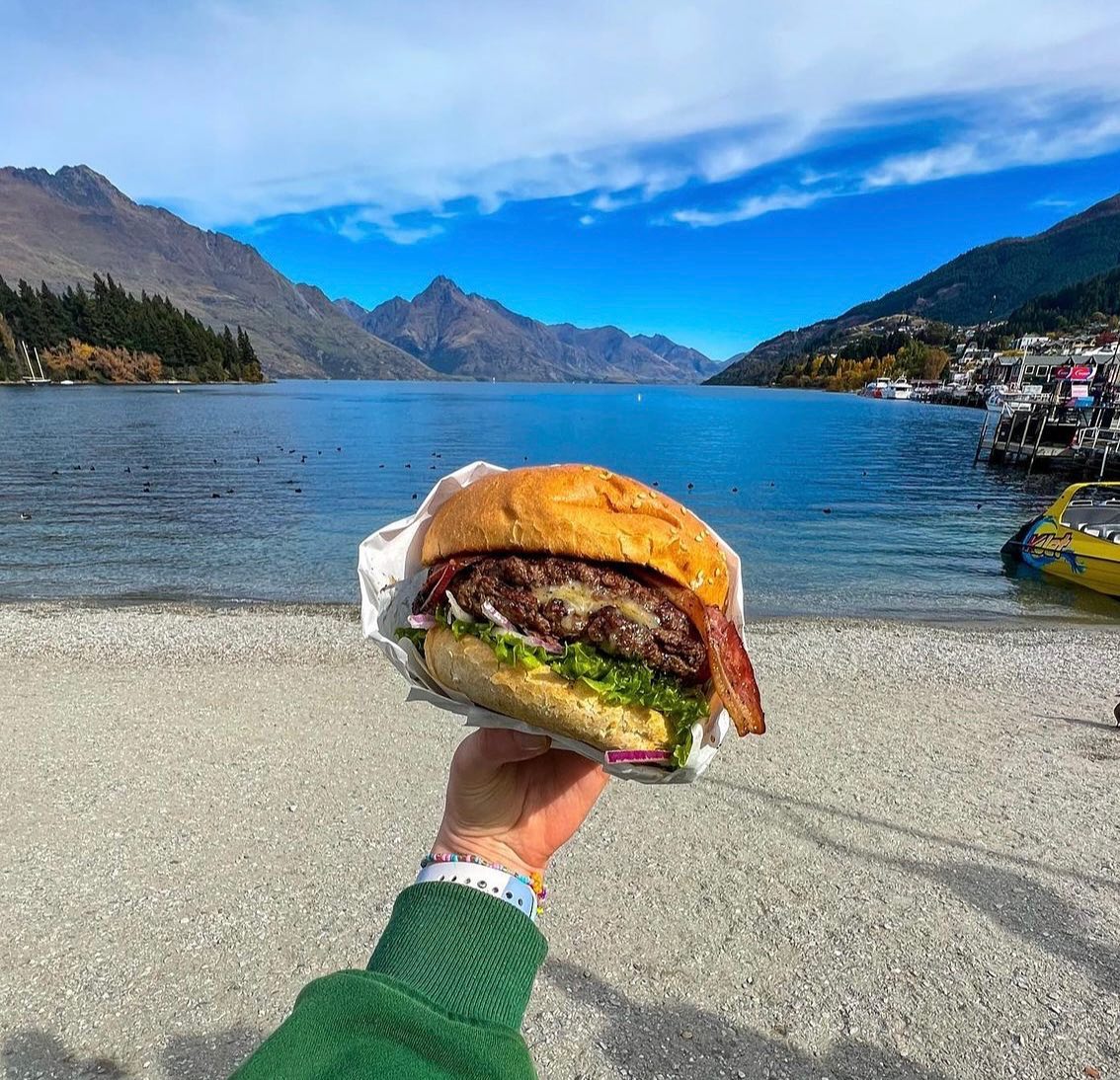 Now that's a burger! A Fergburger and Lake Wakatipu, the perfect combo Now that's a burger! A Fergburger and Lake Wakatipu, the perfect combo