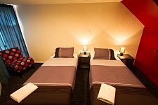 Relax in comfort in a private twin room at Haka Lodge Queenstown