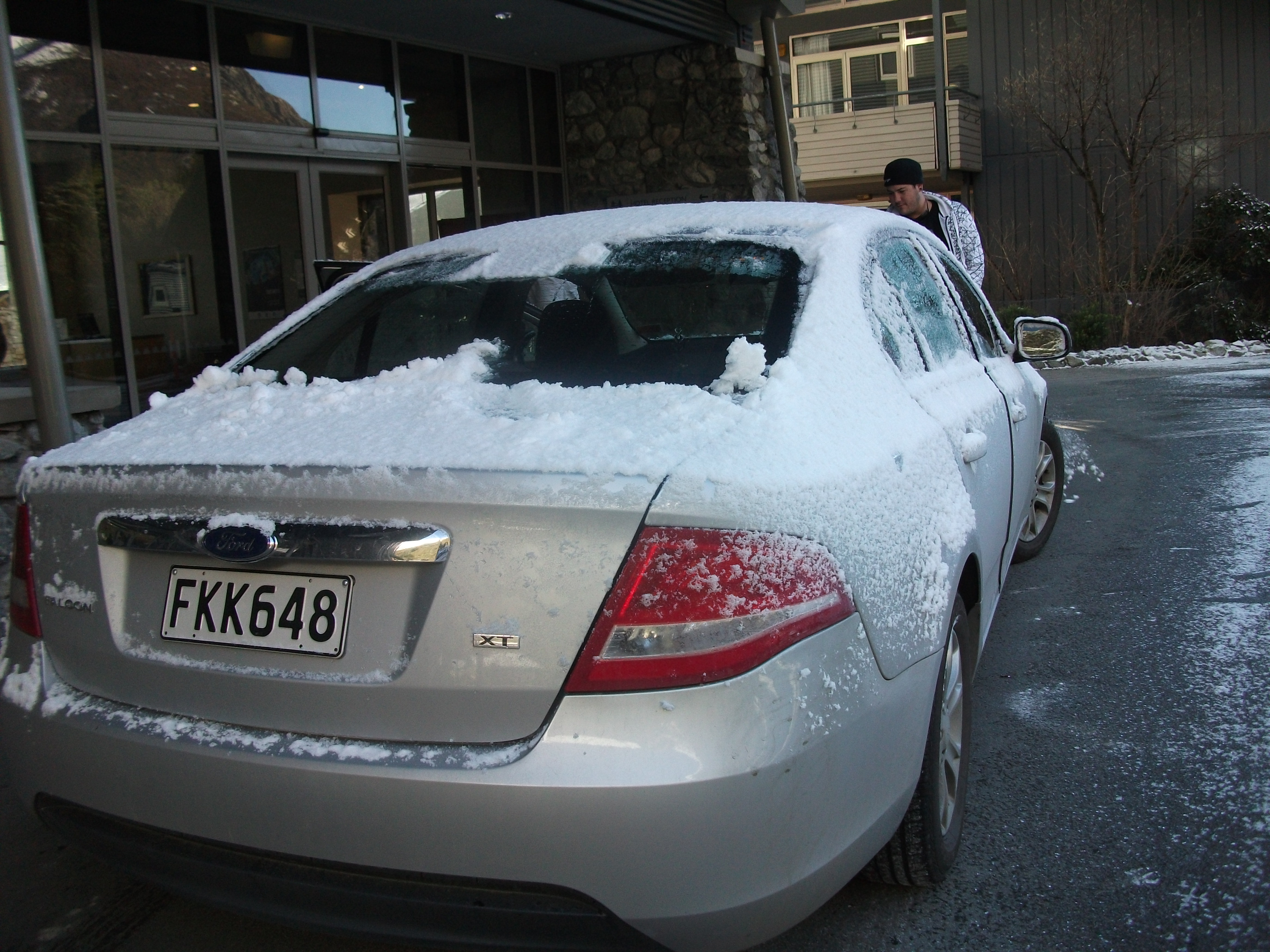 Tim next to our very icy rental car at Mt Cook in 2010 Tim next to our very icy rental car at Mt Cook in 2010