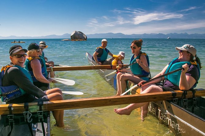 Happy visitors to the Abel Tasman National Park for the Waka Paddling Tour. Click for more information.